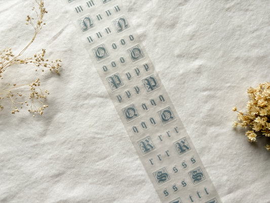 Roll of PET tape with blue fairytale/gothic letters that are pre-cut.